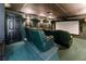 Enjoy movie nights in this home theater with comfortable seating and a large screen at 330 Broad Leaf Ct, Johns Creek, GA 30022