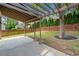 Cozy backyard featuring a covered patio, mature trees, and a well-maintained lawn, perfect for outdoor enjoyment at 604 Bassett Se Ct, Smyrna, GA 30080