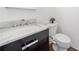 Modern half bathroom featuring a sleek vanity and a stylish sink at 604 Bassett Se Ct, Smyrna, GA 30080