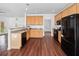 Eat-in kitchen featuring granite countertops, hardwood floors and stainless appliances at 604 Bassett Se Ct, Smyrna, GA 30080