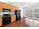 Eat-in kitchen featuring stainless appliances, granite countertops and hardwood floors at 604 Bassett Se Ct, Smyrna, GA 30080