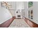 Bright, open living room with hardwood floors, a fireplace and staircase at 604 Bassett Se Ct, Smyrna, GA 30080