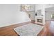 Spacious living room with a fireplace, hardwood floors, and staircase at 604 Bassett Se Ct, Smyrna, GA 30080