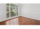 Bright room with hardwood floors and natural light from large windows at 604 Bassett Se Ct, Smyrna, GA 30080