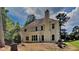 The home's backyard features mature trees and a freshly seeded lawn at 6845 Gledhill Way, Stone Mountain, GA 30087