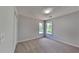 Cozy bedroom boasts plush carpet and bright windows with natural light at 6845 Gledhill Way, Stone Mountain, GA 30087