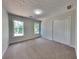 Clean bedroom with carpet, closet, and bright windows with natural light at 6845 Gledhill Way, Stone Mountain, GA 30087
