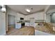 Modern kitchen with white cabinets, granite countertops, and stainless steel appliances at 6845 Gledhill Way, Stone Mountain, GA 30087