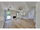 Open living room boasts hardwood floors, a fireplace and access to backyard at 6845 Gledhill Way, Stone Mountain, GA 30087