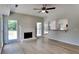 Bright living area featuring a fireplace, hardwood floors, and natural lighting at 6845 Gledhill Way, Stone Mountain, GA 30087