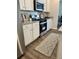 Cozy kitchen with stainless steel oven and granite countertops and tile backsplash at 1195 Park Center Cir, Austell, GA 30168