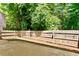 Private back yard featuring patio, wood fence, and mature trees at 2821 Amhurst Nw Way, Kennesaw, GA 30144