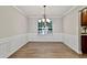 Formal dining room with hardwood floors and classic wainscoting at 2821 Amhurst Nw Way, Kennesaw, GA 30144