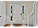 Bright foyer showcasing a white front door with sidelights and a view of the outdoors, complemented by hardwood floors at 2821 Amhurst Nw Way, Kennesaw, GA 30144