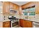 Well-lit kitchen features stainless steel appliances and ample counter space at 2821 Amhurst Nw Way, Kennesaw, GA 30144