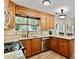 This stylish kitchen has light wood cabinets and granite countertops at 2821 Amhurst Nw Way, Kennesaw, GA 30144