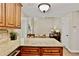 Open kitchen with granite countertops and view to living area at 2821 Amhurst Nw Way, Kennesaw, GA 30144