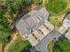 Aerial view of home in a wooded community with mature landscaping at 286 Blue Pointe Ct, Suwanee, GA 30024