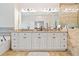 Double vanity bathroom with granite countertops and neutral tiling at 286 Blue Pointe Ct, Suwanee, GA 30024