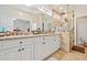 Bright bathroom featuring dual sinks, granite counters and walk in shower at 286 Blue Pointe Ct, Suwanee, GA 30024