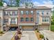 Charming brick townhouse featuring a two-car garage and a well-maintained facade at 286 Blue Pointe Ct, Suwanee, GA 30024