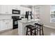 Beautiful kitchen featuring a marble island with seating and stainless-steel appliances at 286 Blue Pointe Ct, Suwanee, GA 30024