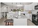 Open concept kitchen with an island, granite countertops, and stainless steel appliances at 286 Blue Pointe Ct, Suwanee, GA 30024