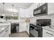 A spacious kitchen with modern stainless steel appliances and bright lighting at 286 Blue Pointe Ct, Suwanee, GA 30024