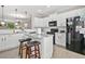 Bright kitchen with white cabinets, granite countertops, and stainless-steel appliances at 286 Blue Pointe Ct, Suwanee, GA 30024