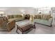 Comfortable living room featuring a glass coffee table, couches, and modern decor at 286 Blue Pointe Ct, Suwanee, GA 30024