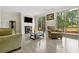 Comfortable living room featuring a fireplace, modern furniture, and a door to the outside at 286 Blue Pointe Ct, Suwanee, GA 30024