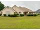 Home exterior featuring a well-maintained front yard at 3222 Wyndham Park Ct, Decatur, GA 30034