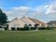 Charming single-story home featuring a well-manicured lawn and mature landscaping at 3222 Wyndham Park Ct, Decatur, GA 30034