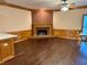 Comfortable living room with a brick fireplace, hardwood floors, and natural lighting at 3222 Wyndham Park Ct, Decatur, GA 30034