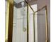 Close up of shower with tile walls, gold frame, and adjustable shower head at 3222 Wyndham Park Ct, Decatur, GA 30034