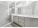 Modern bathroom featuring a spacious glass enclosed shower, double vanity, and contemporary finishes at 3760 Oxford Cir, Doraville, GA 30340