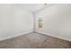 Comfortable bedroom with neutral walls, carpeted floor, and a window with blinds at 3760 Oxford Cir, Doraville, GA 30340