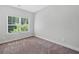 Bedroom features neutral carpet and a window at 3760 Oxford Cir, Doraville, GA 30340