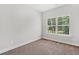 An empty bedroom featuring a window at 3760 Oxford Cir, Doraville, GA 30340