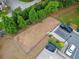 An aerial view of the fenced dog park, with mature trees and an adjacent parking area at 3760 Oxford Cir, Doraville, GA 30340