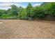 A spacious dog park featuring a bench seating area and a secure fenced perimeter at 3760 Oxford Cir, Doraville, GA 30340