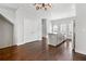 Open-concept kitchen featuring hardwood floors, an island, and stainless steel appliances at 3760 Oxford Cir, Doraville, GA 30340
