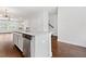 Island kitchen features stainless steel appliances, granite counters, and an open view to the living area at 3760 Oxford Cir, Doraville, GA 30340