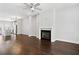 Open-concept living room and kitchen featuring hardwood floors and a fireplace at 3760 Oxford Cir, Doraville, GA 30340