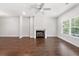 Bright living room with hardwood floors, a fireplace, and natural light from large window at 3760 Oxford Cir, Doraville, GA 30340