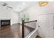 Open-concept living room features hardwood floors, a fireplace, and natural light from large window at 3760 Oxford Cir, Doraville, GA 30340