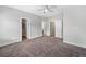 Main bedroom features neutral carpet and multiple doors at 3760 Oxford Cir, Doraville, GA 30340