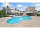 A clear view of the community pool and surrounding townhomes, enhanced by blue skies and greenery at 3760 Oxford Cir, Doraville, GA 30340