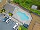 An aerial view of the community pool, parking area, and well-maintained surroundings at 3760 Oxford Cir, Doraville, GA 30340