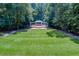 Scenic community amphitheater nestled among mature trees with lush green lawn in the foreground at 4311 Sentinel Nw Pl, Kennesaw, GA 30144